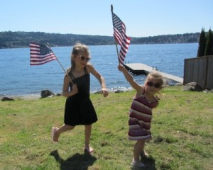 Camryn & Hayden waiving their flags