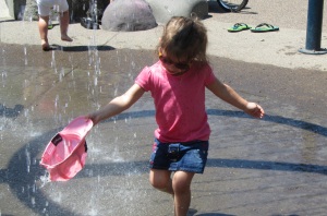 Hayden filling her hat with "rain water"
