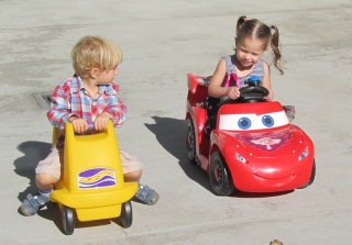 Hayden driving a Lightning McQueen car